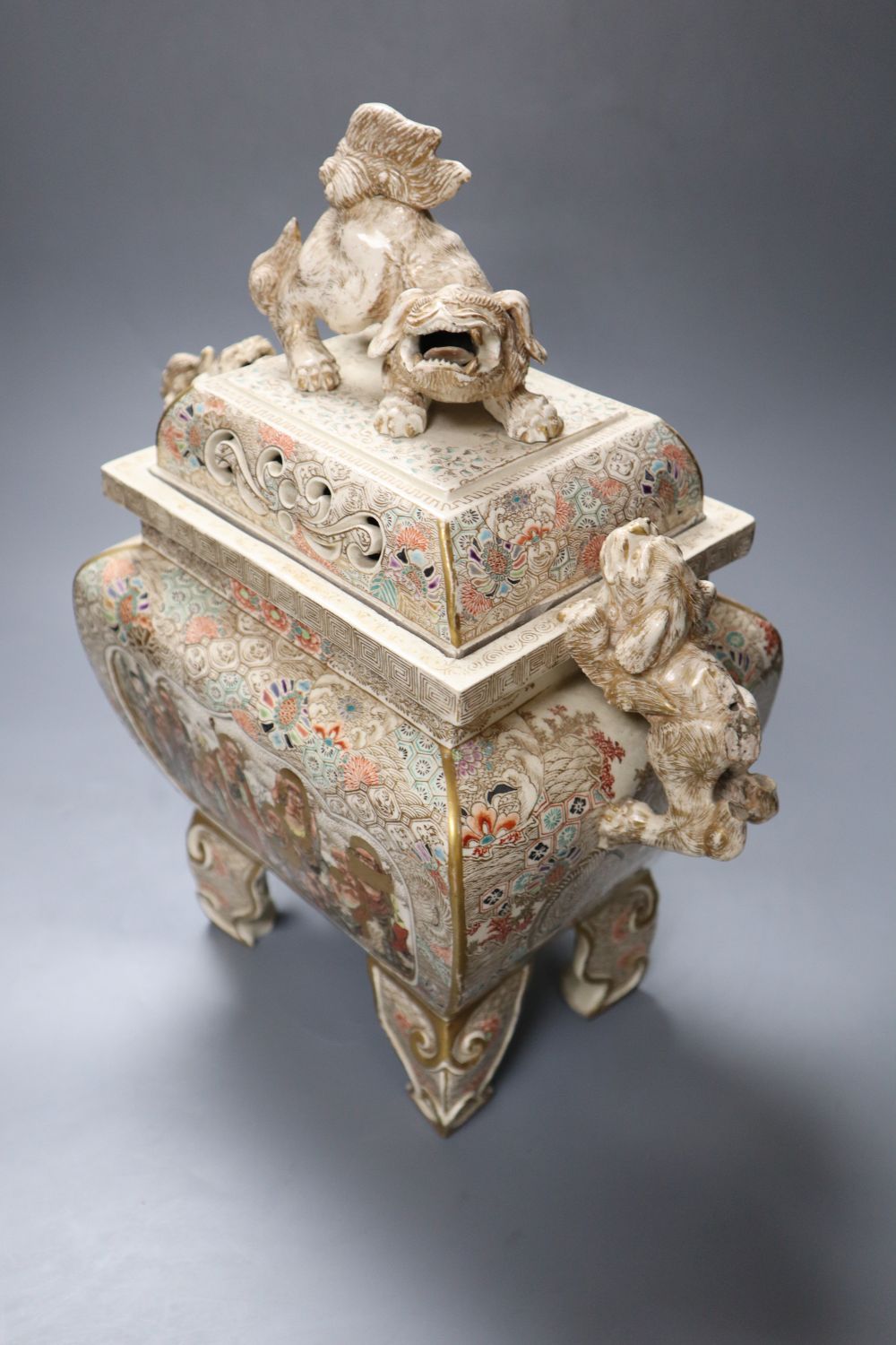 A large Japanese Satsuma pottery koro and cover, with Dog of Fo surmount and handles, 35cm high
